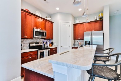 Welcome to 2557 Pete Dye Dr #505, a stunning three-story on Barefoot Resort and Golf Club  in South Carolina - for sale on GolfHomes.com, golf home, golf lot