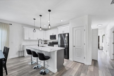 Welcome to this beautifully crafted TURNKEY duplex, offering on Rotonda Golf and Country Club The Palms Course in Florida - for sale on GolfHomes.com, golf home, golf lot