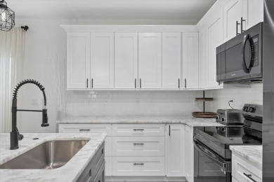 Welcome to this beautifully crafted TURNKEY duplex, offering on Rotonda Golf and Country Club The Palms Course in Florida - for sale on GolfHomes.com, golf home, golf lot