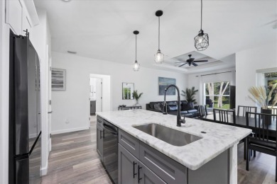 Welcome to this beautifully crafted TURNKEY duplex, offering on Rotonda Golf and Country Club The Palms Course in Florida - for sale on GolfHomes.com, golf home, golf lot