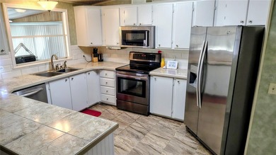 Welcome to this two bedroom two bath home located in the highly on Plantation Golf Club in Florida - for sale on GolfHomes.com, golf home, golf lot