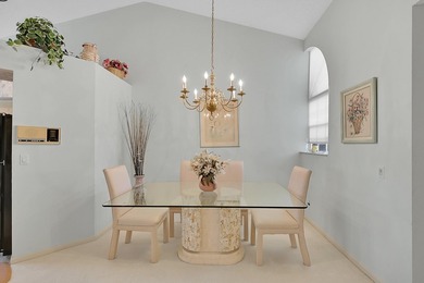 YOU'LL INSTANTLY FEEL AT HOME WHEN YOU STEP INTO THIS VAULTEDV on The Boca Country Club in Florida - for sale on GolfHomes.com, golf home, golf lot