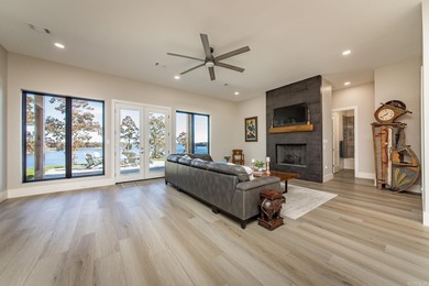 Breathtaking Modern Lakefront Retreat with Boat Slip Welcome to on Indian Hills Country Club in Arkansas - for sale on GolfHomes.com, golf home, golf lot