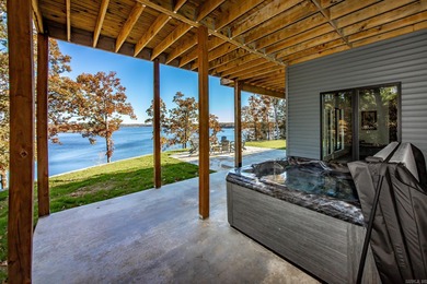 Breathtaking Modern Lakefront Retreat with Boat Slip Welcome to on Indian Hills Country Club in Arkansas - for sale on GolfHomes.com, golf home, golf lot