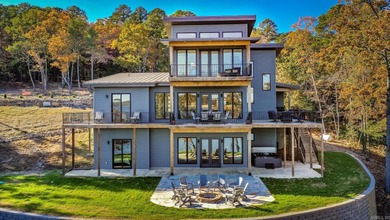 Breathtaking Modern Lakefront Retreat with Boat Slip Welcome to on Indian Hills Country Club in Arkansas - for sale on GolfHomes.com, golf home, golf lot