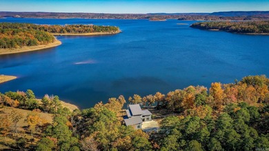 Breathtaking Modern Lakefront Retreat with Boat Slip Welcome to on Indian Hills Country Club in Arkansas - for sale on GolfHomes.com, golf home, golf lot