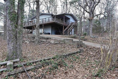 Nestled on a quiet street in the Bay, this charming home sits on on Indian Hills Country Club in Arkansas - for sale on GolfHomes.com, golf home, golf lot