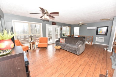 Nestled on a quiet street in the Bay, this charming home sits on on Indian Hills Country Club in Arkansas - for sale on GolfHomes.com, golf home, golf lot