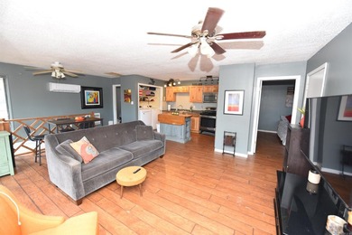 Nestled on a quiet street in the Bay, this charming home sits on on Indian Hills Country Club in Arkansas - for sale on GolfHomes.com, golf home, golf lot