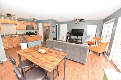 Nestled on a quiet street in the Bay, this charming home sits on on Indian Hills Country Club in Arkansas - for sale on GolfHomes.com, golf home, golf lot