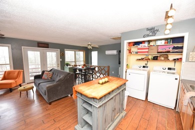 Nestled on a quiet street in the Bay, this charming home sits on on Indian Hills Country Club in Arkansas - for sale on GolfHomes.com, golf home, golf lot