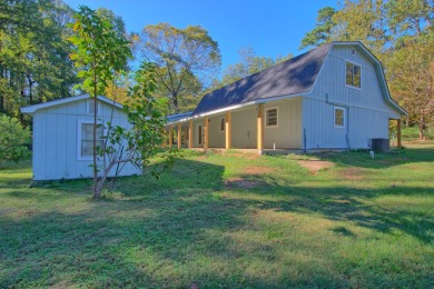 This 2 story beauty backs up to the national forest and is a on Pendleton Harbor in Texas - for sale on GolfHomes.com, golf home, golf lot