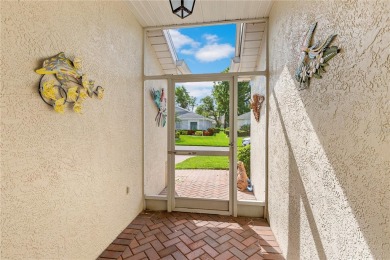 As you enter the enclosed entryway and step into the foyer the on Scepter Golf Club in Florida - for sale on GolfHomes.com, golf home, golf lot