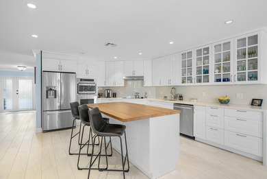 WOW! Perfectly sited on a premier .34-acre lot overlooking one on Atlantis Golf Club in Florida - for sale on GolfHomes.com, golf home, golf lot