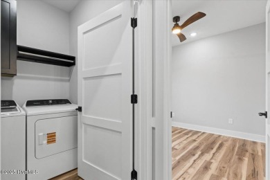 This adorable home is so full of sass... Spacious open floorplan on Pearl Golf Links in North Carolina - for sale on GolfHomes.com, golf home, golf lot