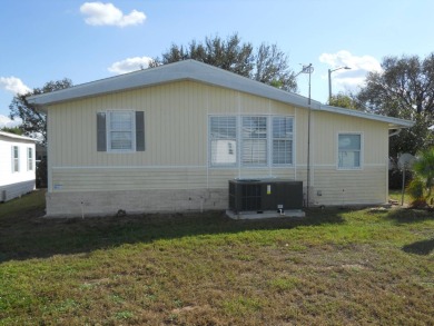 Charming two bedroom, one and a half bathroom home in the Bass on Polo Park East in Florida - for sale on GolfHomes.com, golf home, golf lot