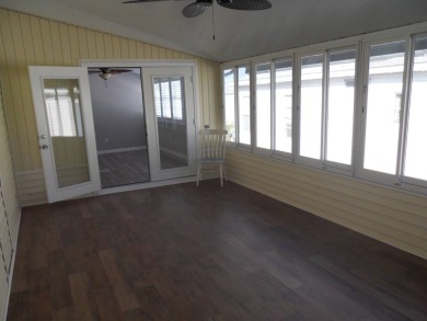 Charming two bedroom, one and a half bathroom home in the Bass on Polo Park East in Florida - for sale on GolfHomes.com, golf home, golf lot