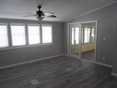 Charming two bedroom, one and a half bathroom home in the Bass on Polo Park East in Florida - for sale on GolfHomes.com, golf home, golf lot