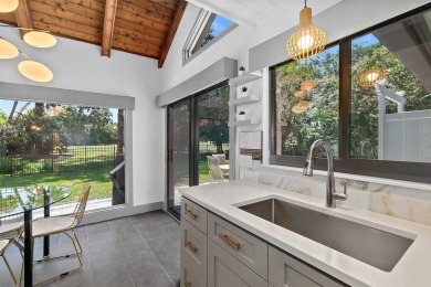 Discover the epitome of mid-century modern design, now on Palm Harbor Golf Club in Florida - for sale on GolfHomes.com, golf home, golf lot