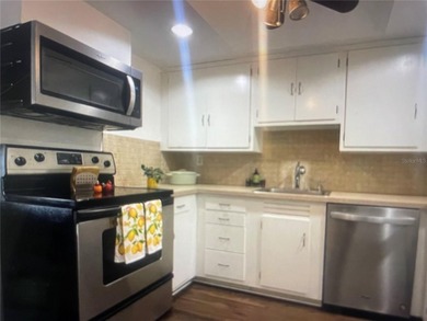 Fabulous 55+ Upstairs FURNISHED TURNKEY condo with great views on Country Club At Silver Springs Shores in Florida - for sale on GolfHomes.com, golf home, golf lot