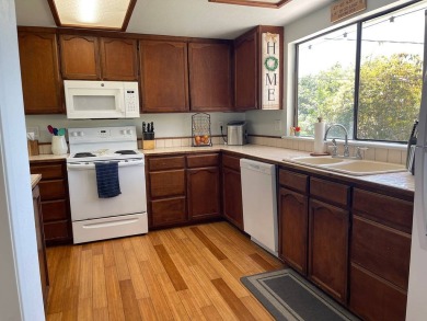This beautiful home sits directly on the golf course in a quiet on Discovery Harbour Golf Course in Hawaii - for sale on GolfHomes.com, golf home, golf lot