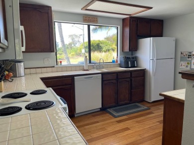 This beautiful home sits directly on the golf course in a quiet on Discovery Harbour Golf Course in Hawaii - for sale on GolfHomes.com, golf home, golf lot