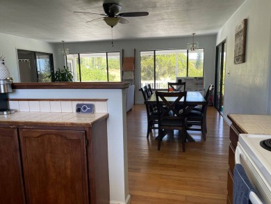 This beautiful home sits directly on the golf course in a quiet on Discovery Harbour Golf Course in Hawaii - for sale on GolfHomes.com, golf home, golf lot