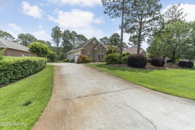 This well built, elegant home offers a unique blend of luxury on Sea Trail Golf Resort in North Carolina - for sale on GolfHomes.com, golf home, golf lot