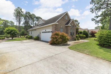 This well built, elegant home offers a unique blend of luxury on Sea Trail Golf Resort in North Carolina - for sale on GolfHomes.com, golf home, golf lot