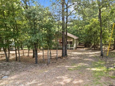 Nestled in the prestigious Holly Lake Ranch subdivision and on Holly Lake Ranch Golf Club in Texas - for sale on GolfHomes.com, golf home, golf lot