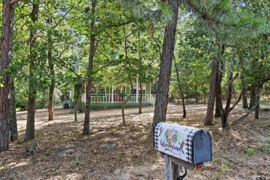 Nestled in the prestigious Holly Lake Ranch subdivision and on Holly Lake Ranch Golf Club in Texas - for sale on GolfHomes.com, golf home, golf lot
