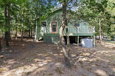 Nestled in the prestigious Holly Lake Ranch subdivision and on Holly Lake Ranch Golf Club in Texas - for sale on GolfHomes.com, golf home, golf lot