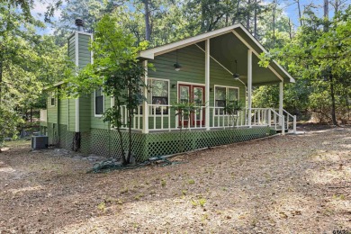 Nestled in the prestigious Holly Lake Ranch subdivision and on Holly Lake Ranch Golf Club in Texas - for sale on GolfHomes.com, golf home, golf lot