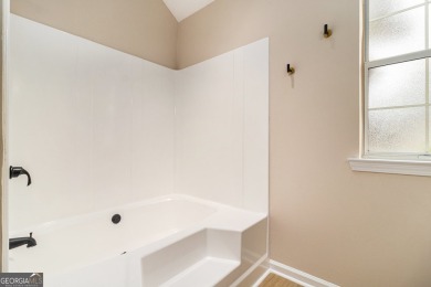 Step into this beautifully updated 3 bedroom, 2 bath on Canongate At Flat Creek Club in Georgia - for sale on GolfHomes.com, golf home, golf lot