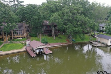 Nestled in the serene community of Hideaway Lake, this charming on Hide-A-Way Lake Golf Course in Texas - for sale on GolfHomes.com, golf home, golf lot