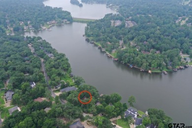 Nestled in the serene community of Hideaway Lake, this charming on Hide-A-Way Lake Golf Course in Texas - for sale on GolfHomes.com, golf home, golf lot