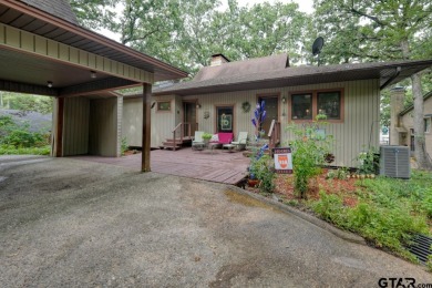 Nestled in the serene community of Hideaway Lake, this charming on Hide-A-Way Lake Golf Course in Texas - for sale on GolfHomes.com, golf home, golf lot