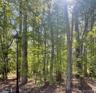 This beautiful wooded lot is located on a quiet cul-de-sac and on Fords Colony Country Club At Williamsburg in Virginia - for sale on GolfHomes.com, golf home, golf lot