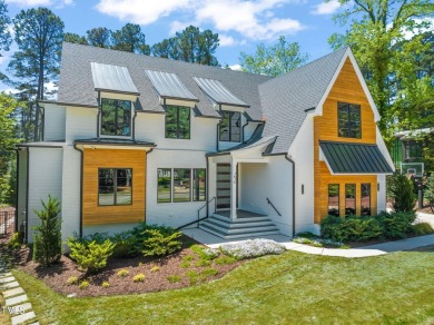 Step into elevated luxury in this custom-built masterpiece on North Ridge Country Club in North Carolina - for sale on GolfHomes.com, golf home, golf lot