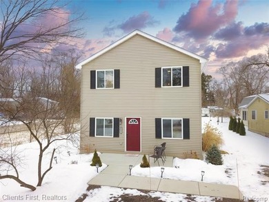 Welcome home to this fully remodeled and beautifully upgraded on Rush Lake Hills Golf Club in Michigan - for sale on GolfHomes.com, golf home, golf lot