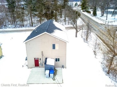 Welcome home to this fully remodeled and beautifully upgraded on Rush Lake Hills Golf Club in Michigan - for sale on GolfHomes.com, golf home, golf lot