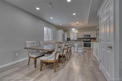 Welcome home to this fully remodeled and beautifully upgraded on Rush Lake Hills Golf Club in Michigan - for sale on GolfHomes.com, golf home, golf lot