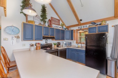 Welcome to 'Evening Shade', a charming, furnished cabin nestled on Alpine Lake Resort in West Virginia - for sale on GolfHomes.com, golf home, golf lot