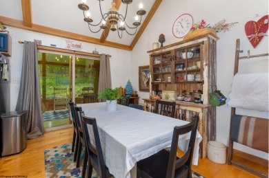 Welcome to 'Evening Shade', a charming, furnished cabin nestled on Alpine Lake Resort in West Virginia - for sale on GolfHomes.com, golf home, golf lot