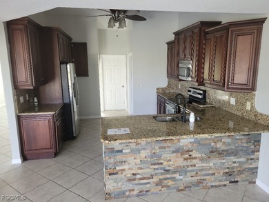 Welcome to this exceptional 3-bedroom, 2.5-bath pool home on Royal Tee Country Club in Florida - for sale on GolfHomes.com, golf home, golf lot