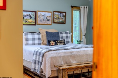 Welcome to 'Evening Shade', a charming, furnished cabin nestled on Alpine Lake Resort in West Virginia - for sale on GolfHomes.com, golf home, golf lot