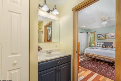 Welcome to 'Evening Shade', a charming, furnished cabin nestled on Alpine Lake Resort in West Virginia - for sale on GolfHomes.com, golf home, golf lot