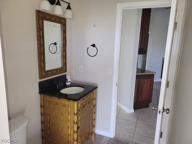 Welcome to this exceptional 3-bedroom, 2.5-bath pool home on Royal Tee Country Club in Florida - for sale on GolfHomes.com, golf home, golf lot