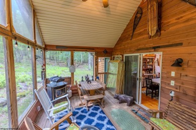 Welcome to 'Evening Shade', a charming, furnished cabin nestled on Alpine Lake Resort in West Virginia - for sale on GolfHomes.com, golf home, golf lot