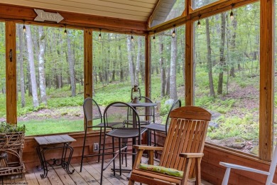 Welcome to 'Evening Shade', a charming, furnished cabin nestled on Alpine Lake Resort in West Virginia - for sale on GolfHomes.com, golf home, golf lot